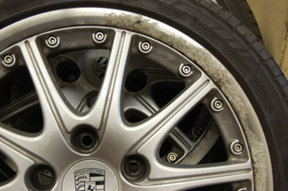 Porsche 911 (996) 18" splitrim showing corrosion, stone chips and dull paintwork 