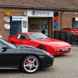 Two Porsches outside the workshop